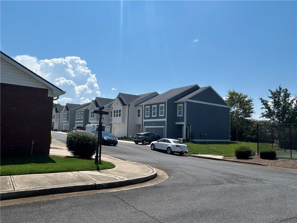 115 Old Mill Drive Calhoun, GA 30701 - Photo 26 of 28 a front view of a house with garden