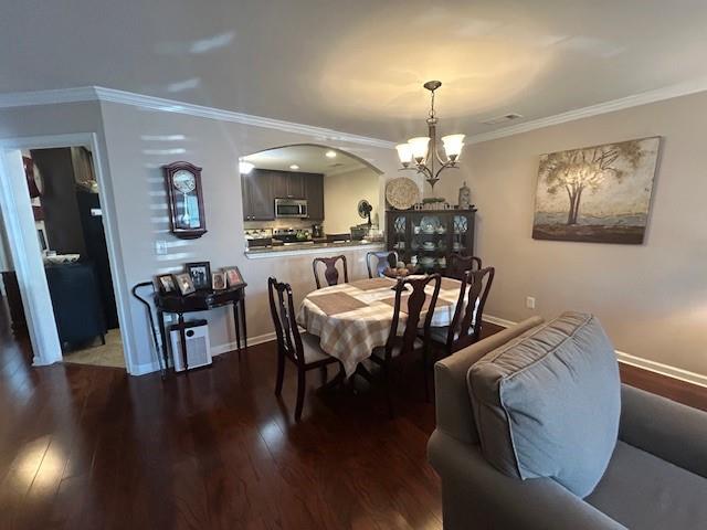 115 Old Mill Drive Calhoun, GA 30701 - Photo 6 of 28 a view of a dining room with furniture and wooden floor