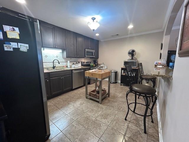 115 Old Mill Drive Calhoun, GA 30701 - Photo 9 of 28 a kitchen with stainless steel appliances granite countertop sink stove top oven and cabinets