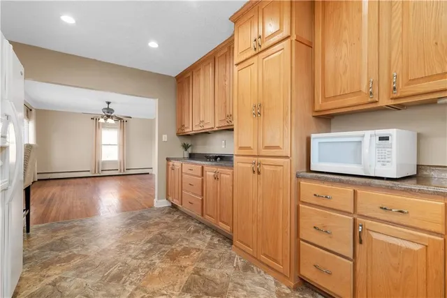 a view of a kitchen with electric appliances