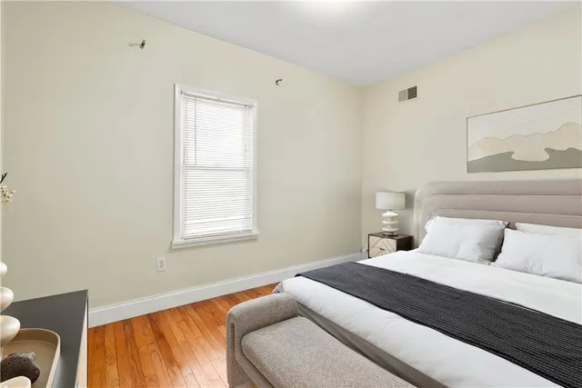 a bedroom with a bed and window