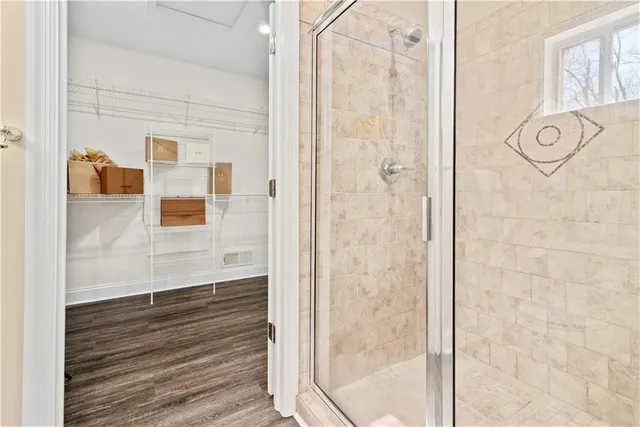 a bathroom with a shower and a sink