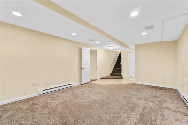 a living room with furniture and potted plant