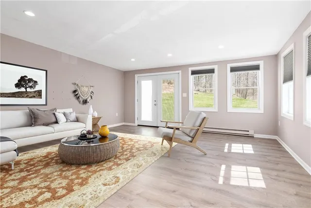 a living room with furniture and a large window