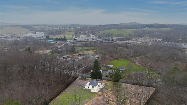 a view of a back yard of a house with a yard