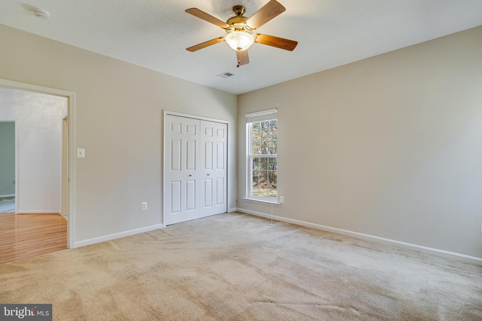 14850 King Charles Drive Issue, MD 20645 - Photo 14 of 63 a view of a livingroom with a ceiling fan and window