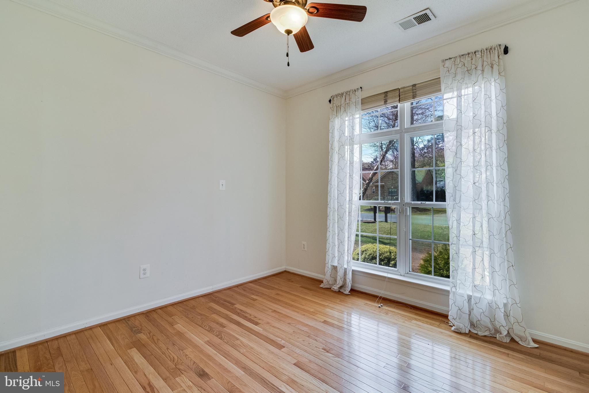 14850 King Charles Drive Issue, MD 20645 - Photo 17 of 63 wooden floor in an empty room with a window