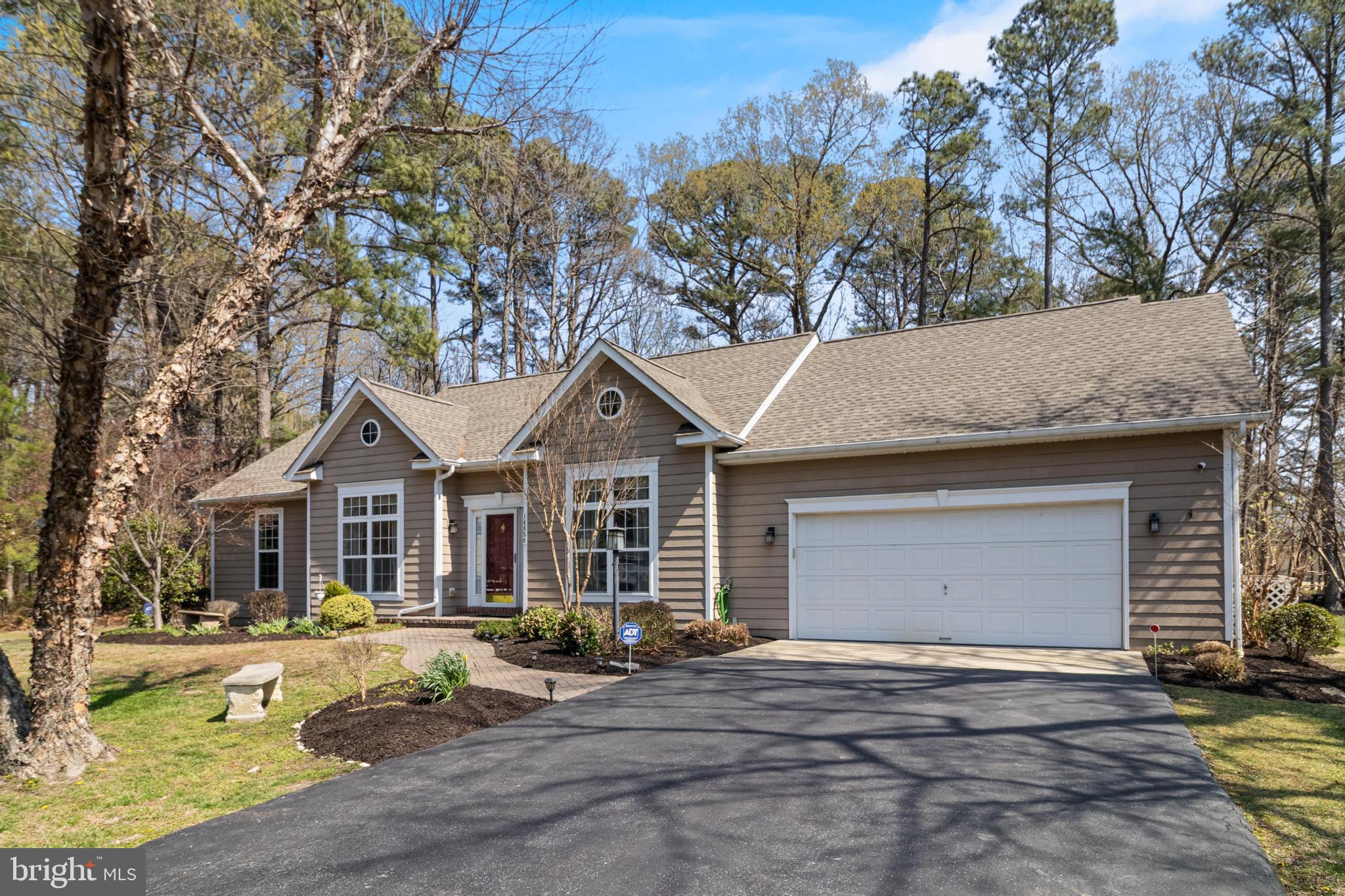 14850 King Charles Drive Issue, MD 20645 - Photo 2 of 63 a front view of a house with garden