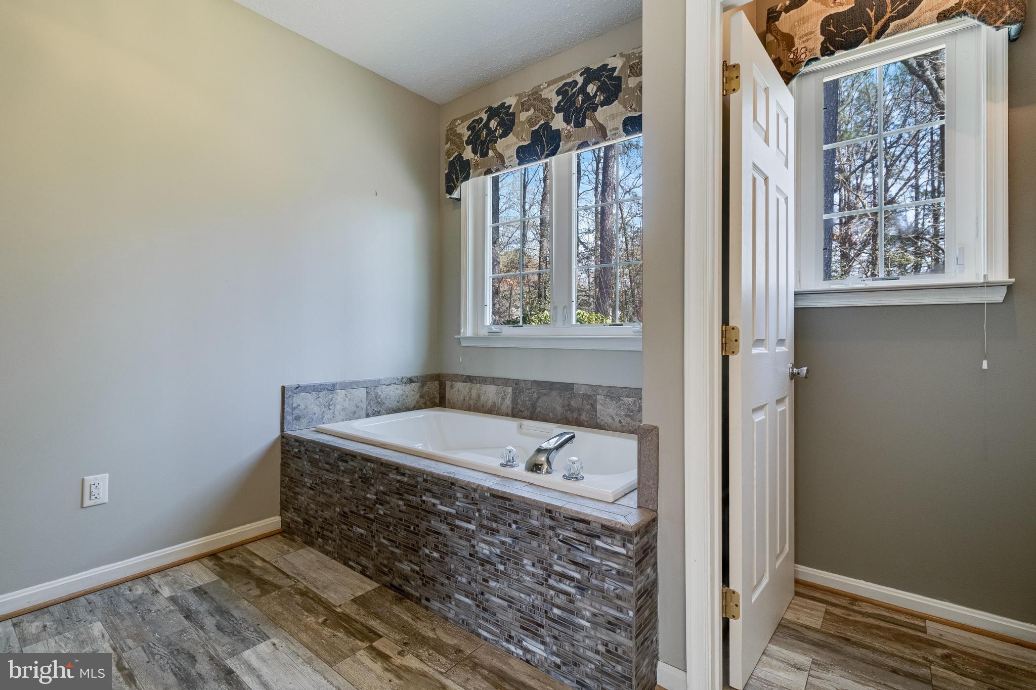 14850 King Charles Drive Issue, MD 20645 - Photo 32 of 63 a bathroom with a tub sink and window