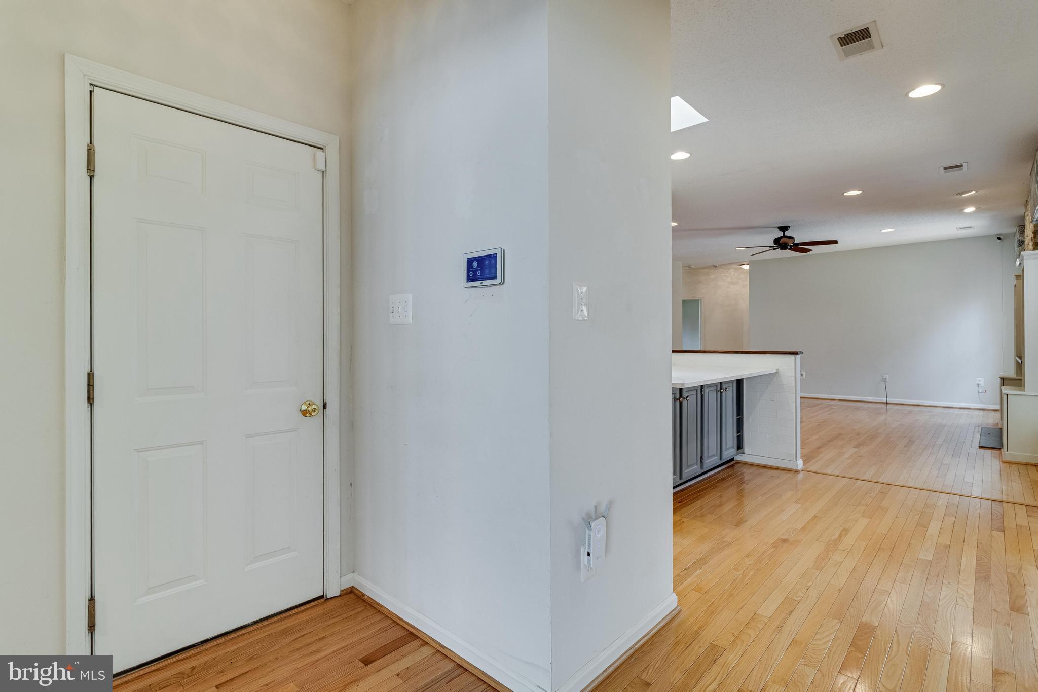 14850 King Charles Drive Issue, MD 20645 - Photo 36 of 63 wooden floor in an empty room with a window
