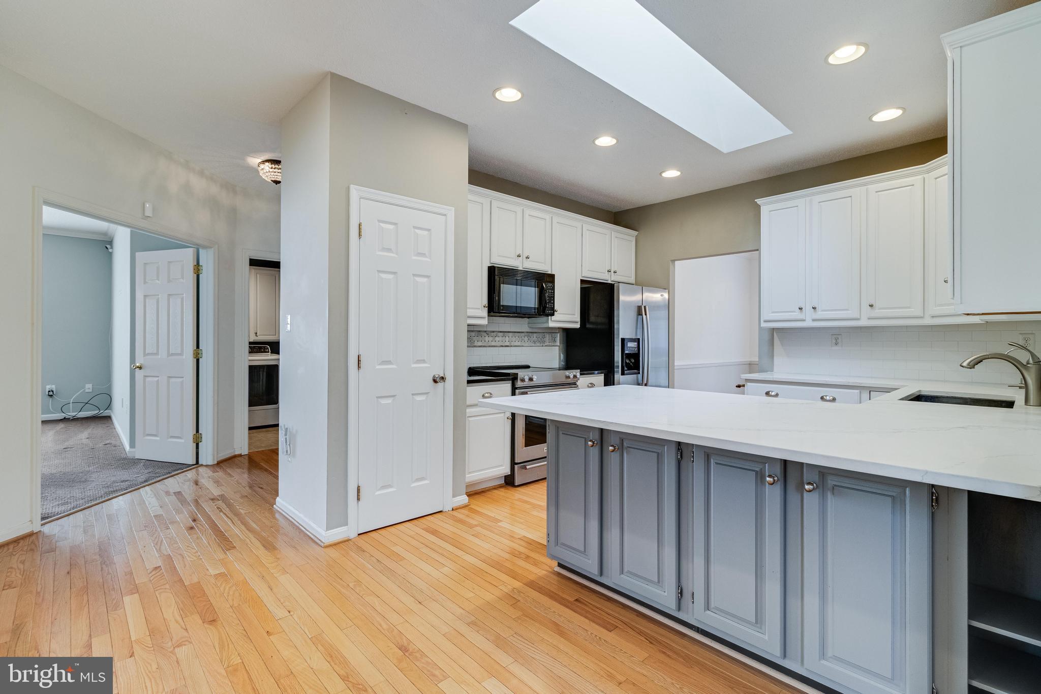 14850 King Charles Drive Issue, MD 20645 - Photo 6 of 63 a kitchen with a sink microwave and refrigerator