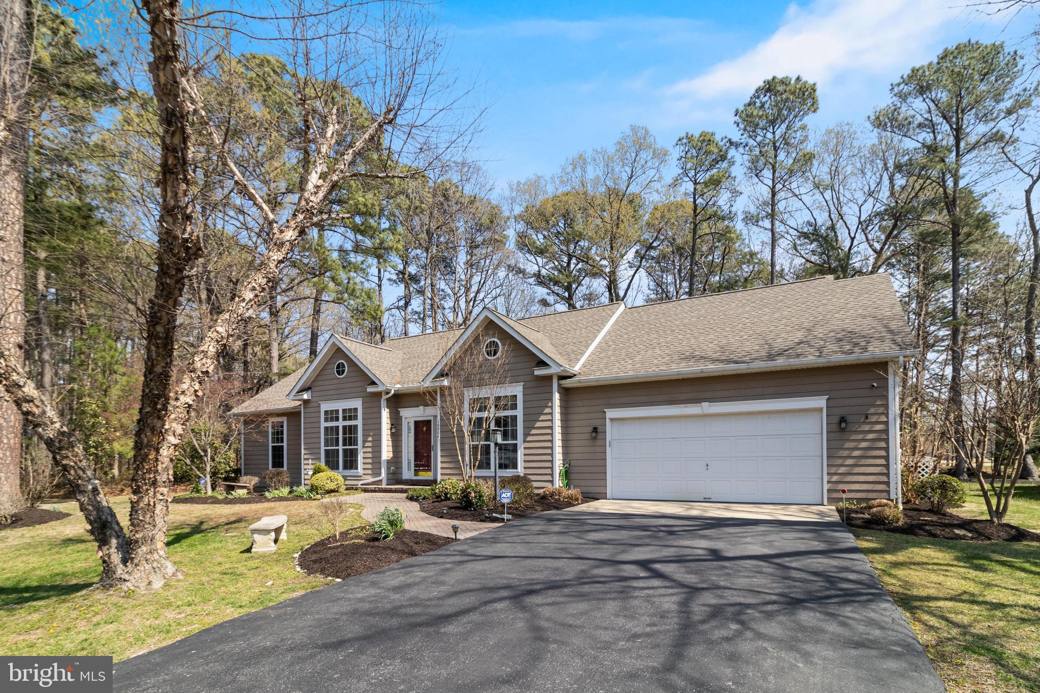14850 King Charles Drive Issue, MD 20645 - Photo 62 of 63 a front view of a house with garden