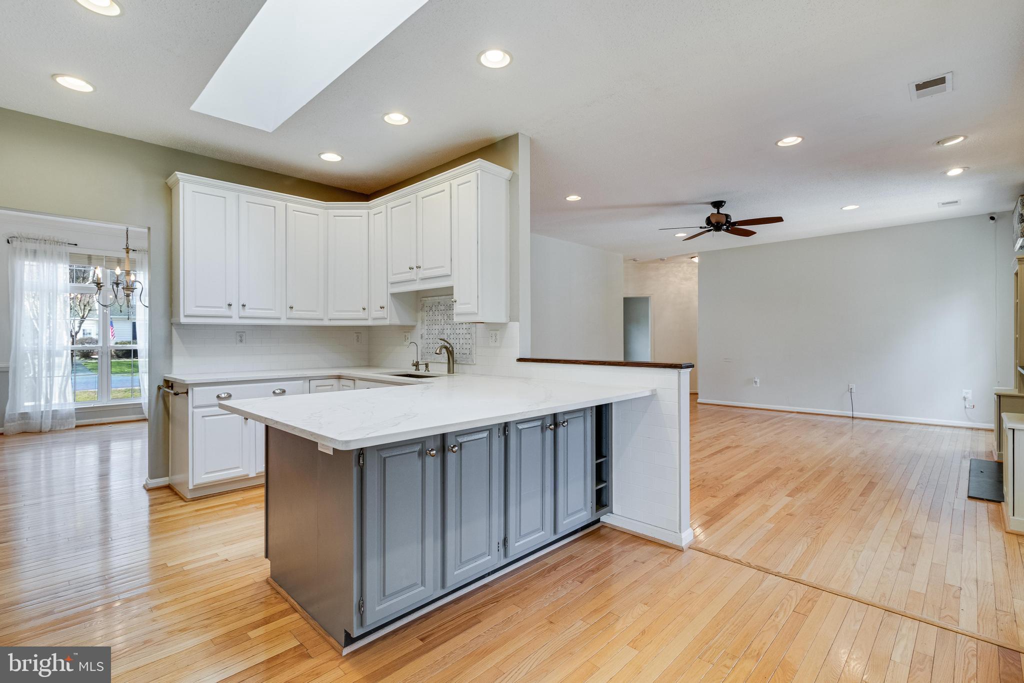 14850 King Charles Drive Issue, MD 20645 - Photo 10 of 63 a kitchen that has a sink and a stove in it