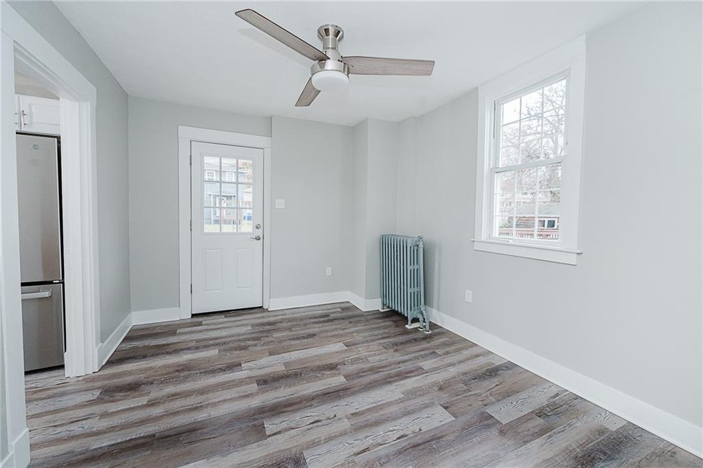 887 Millville Road Altoona, PA 16601 - Photo 13 of 29 a view of an empty room with wooden floor and a window