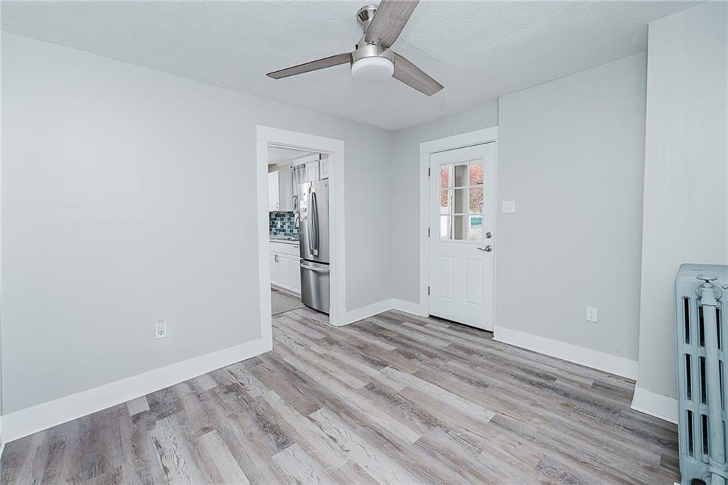 887 Millville Road Altoona, PA 16601 - Photo 14 of 29 wooden floor in an empty room with a window