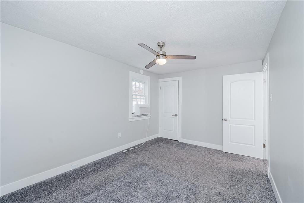 887 Millville Road Altoona, PA 16601 - Photo 21 of 29 a view of a livingroom with a ceiling fan and window