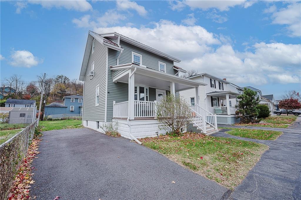 887 Millville Road Altoona, PA 16601 - Photo 3 of 29 a front view of a house with garden and trees