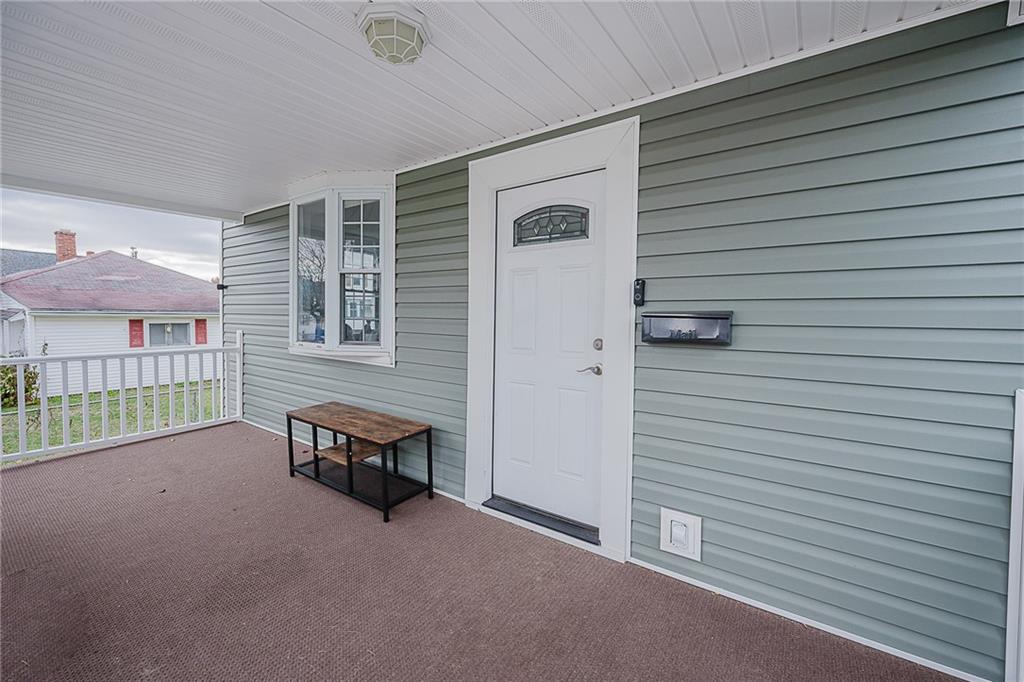 887 Millville Road Altoona, PA 16601 - Photo 4 of 29 a view of a porch with furniture and a yard