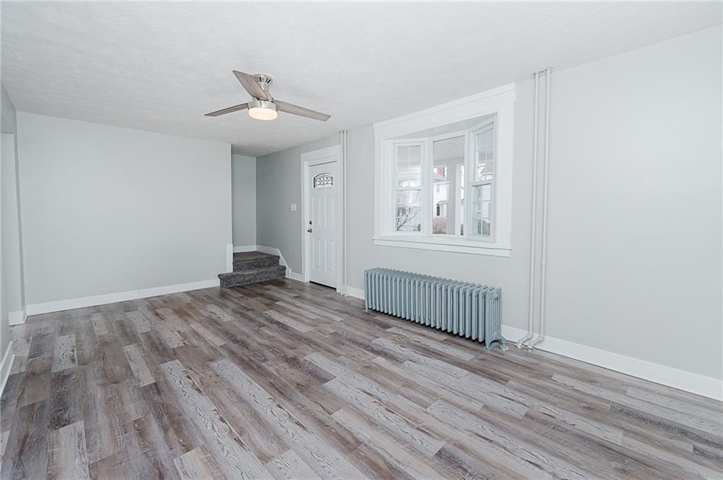 887 Millville Road Altoona, PA 16601 - Photo 7 of 29 wooden floor in an empty room with a window