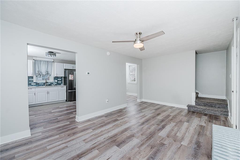 887 Millville Road Altoona, PA 16601 - Photo 8 of 29 a view of a kitchen with wooden floor and a sink
