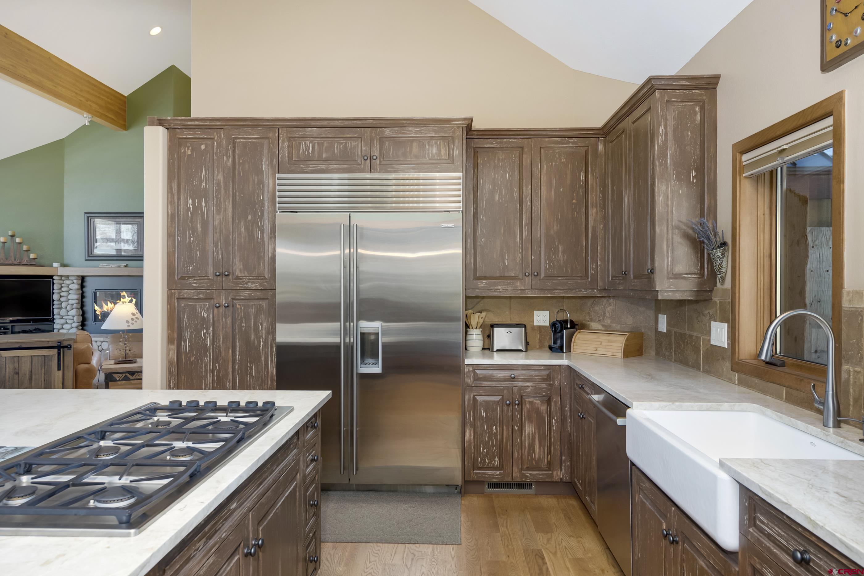 15 Nicholson Lane Crested Butte, CO 81224 - Photo 14 of 42 a kitchen with stainless steel appliances granite countertop a sink stove and refrigerator
