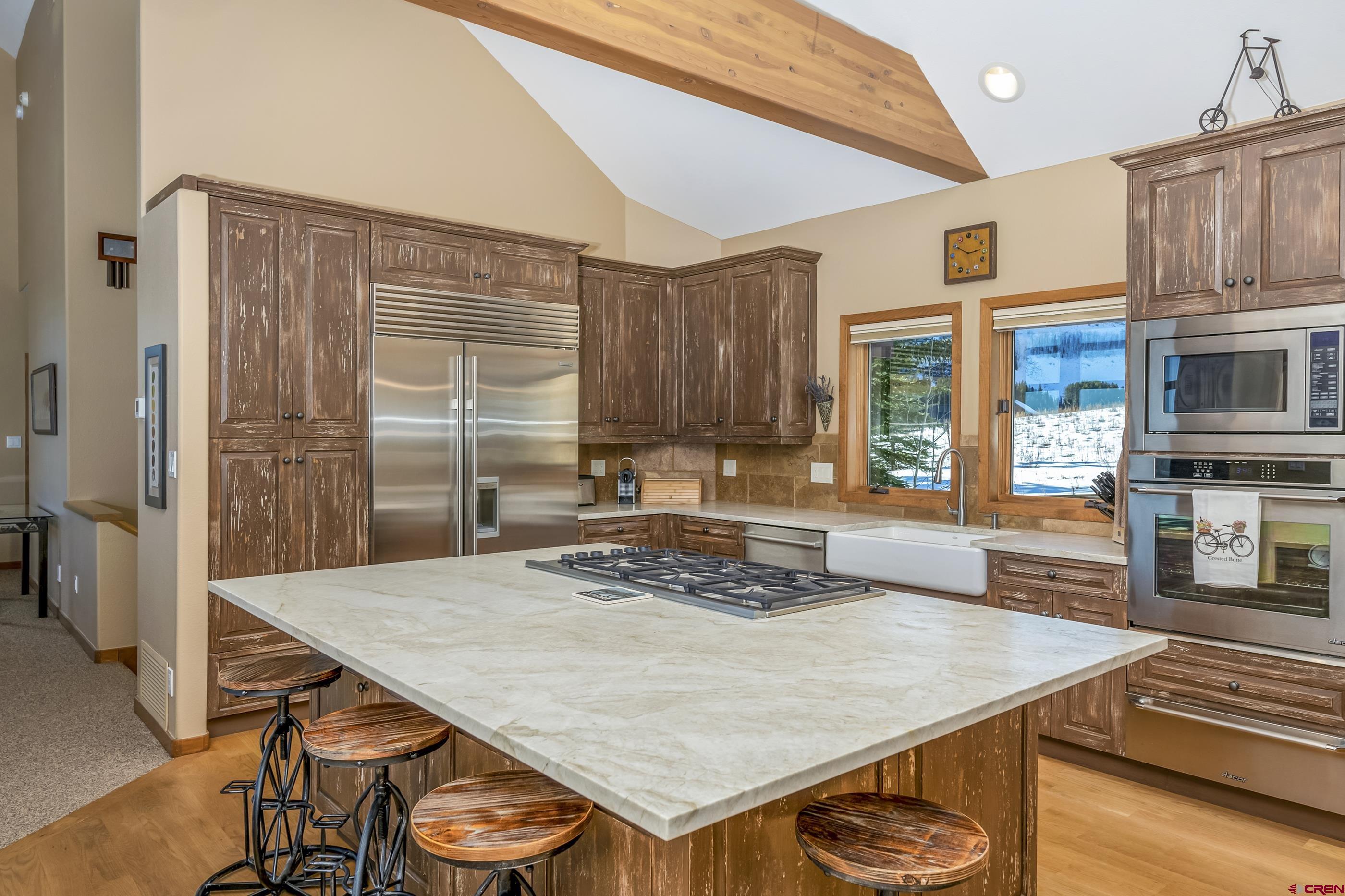15 Nicholson Lane Crested Butte, CO 81224 - Photo 15 of 42 a kitchen with a table chairs and a refrigerator
