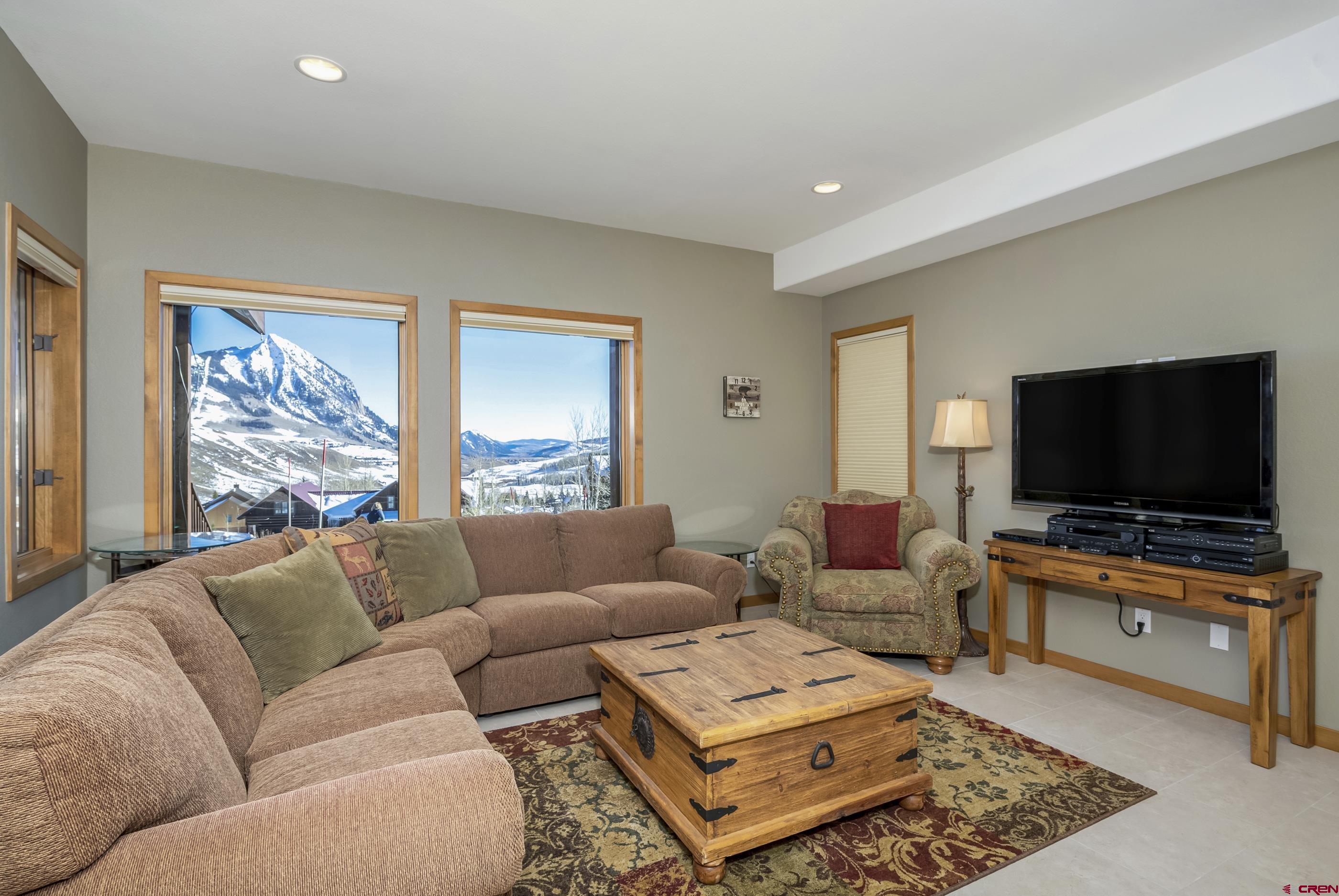 15 Nicholson Lane Crested Butte, CO 81224 - Photo 17 of 42 a living room with furniture and a flat screen tv