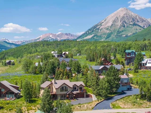 a view of a house with a yard and a large pool