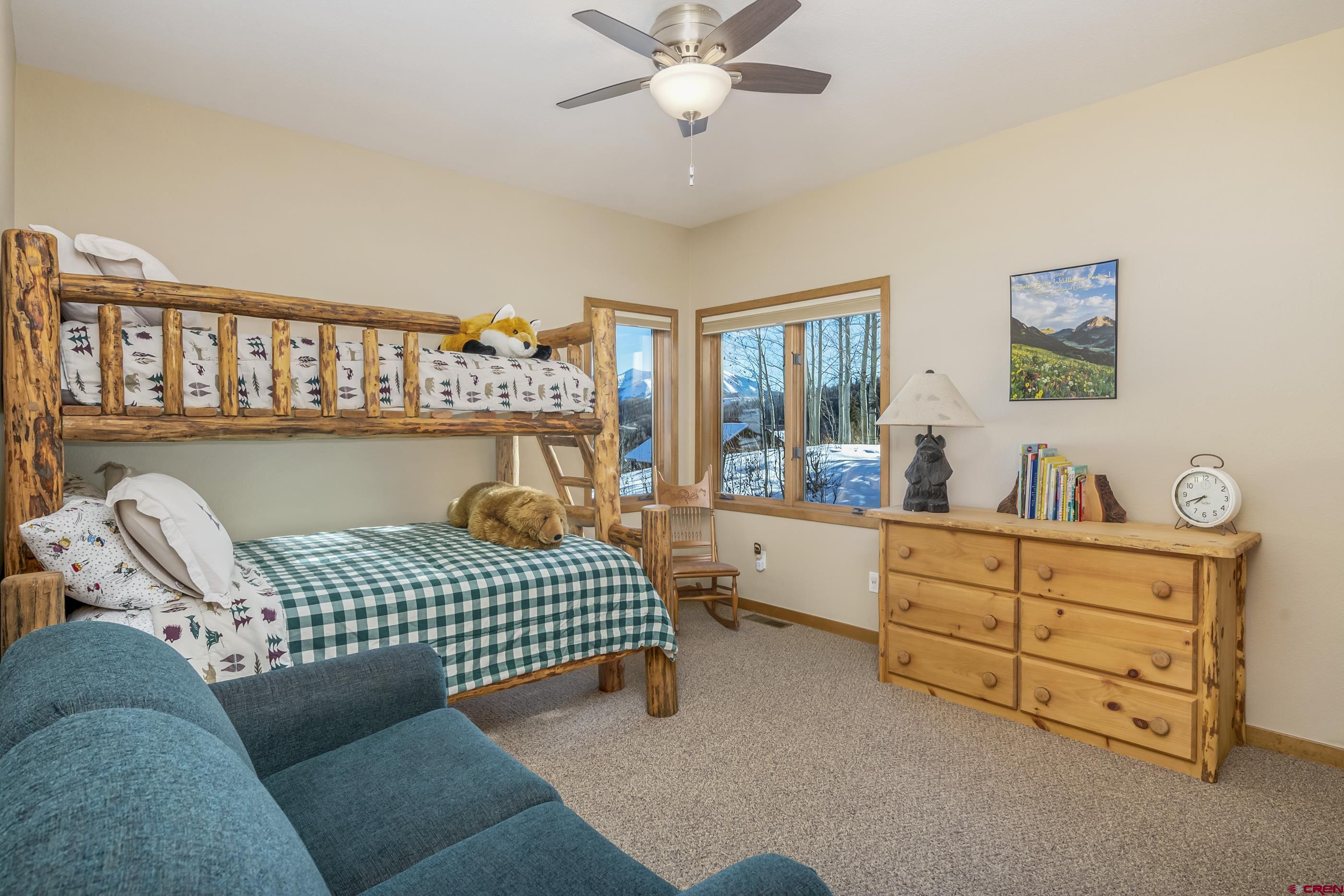 15 Nicholson Lane Crested Butte, CO 81224 - Photo 22 of 42 a bedroom with furniture and a window