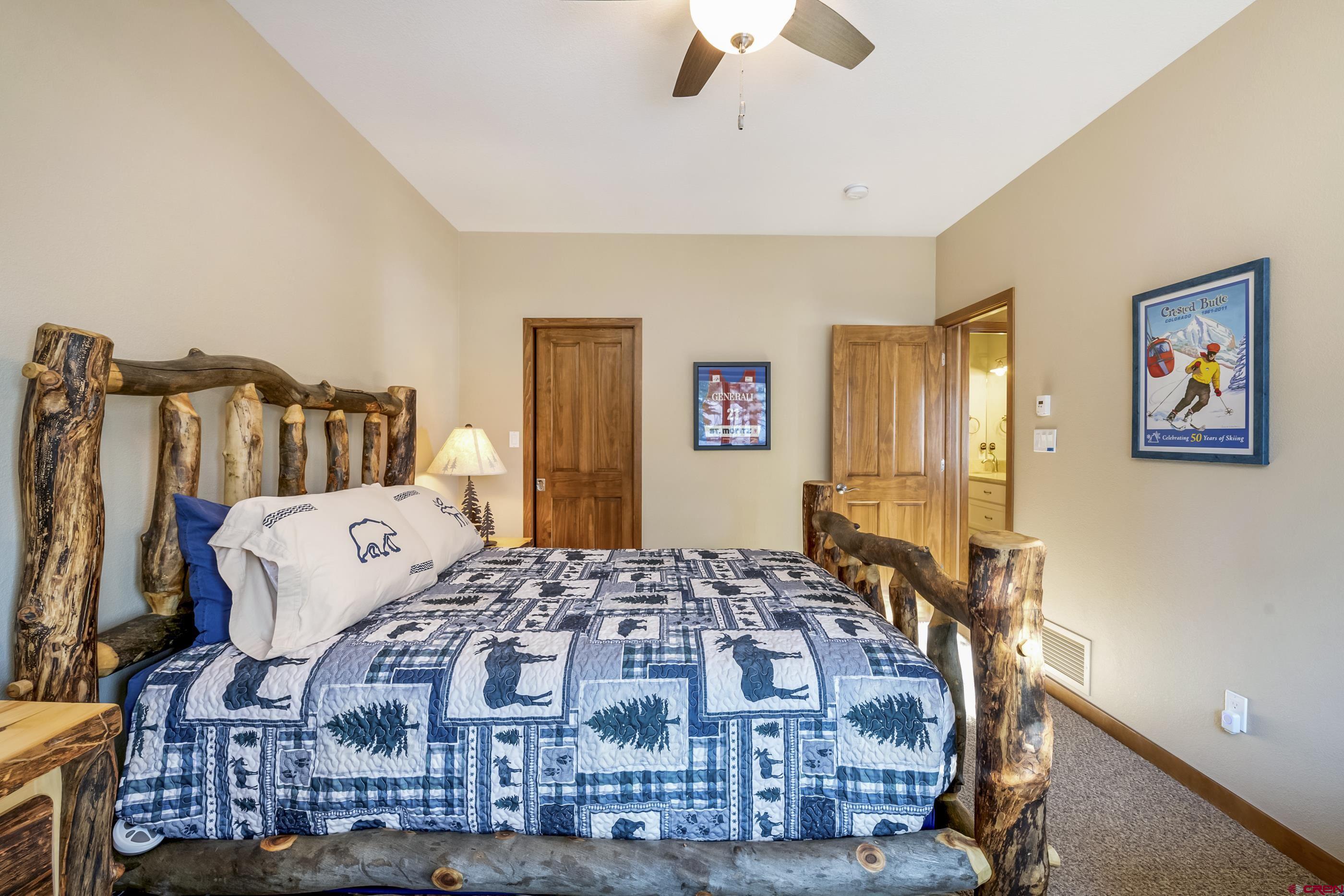 15 Nicholson Lane Crested Butte, CO 81224 - Photo 25 of 42 a bedroom with bed and wooden floor