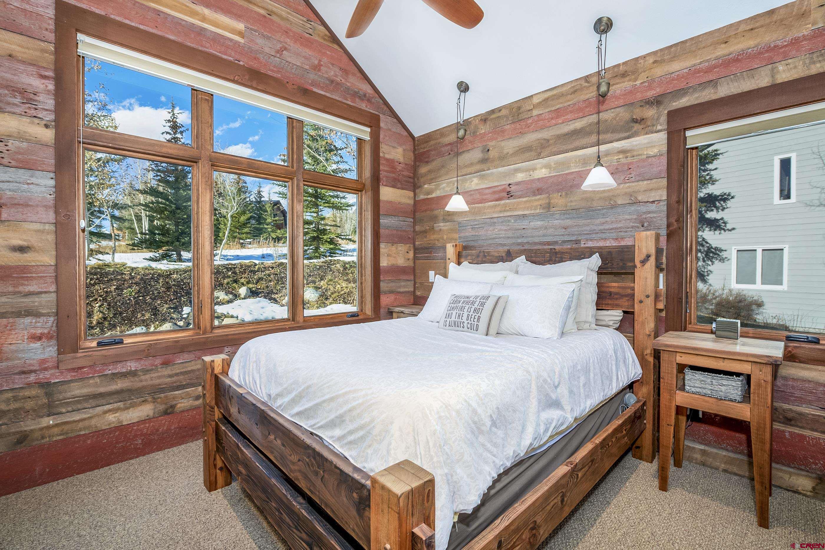 15 Nicholson Lane Crested Butte, CO 81224 - Photo 32 of 42 a bed sitting in a bedroom next to a window