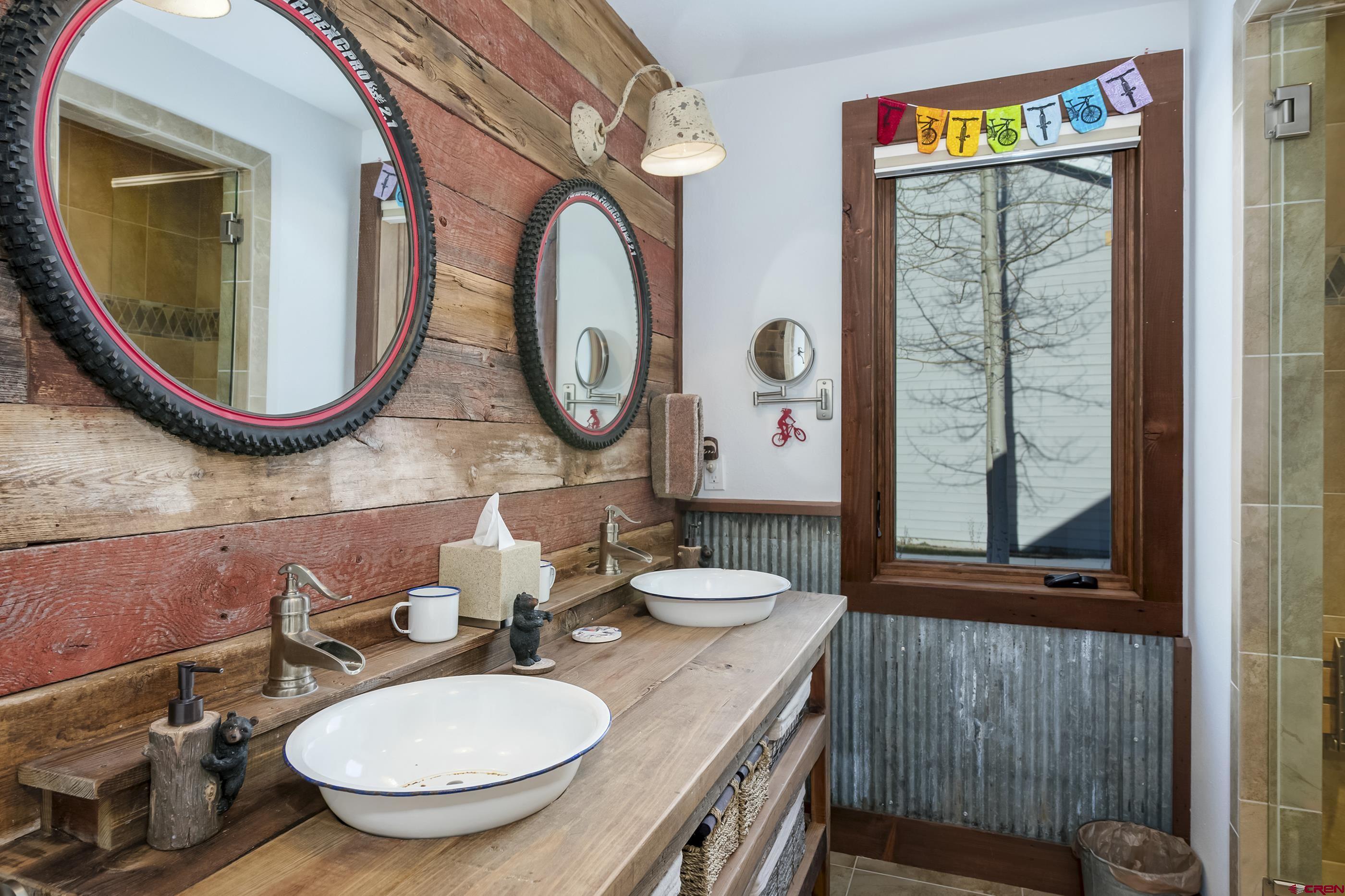 15 Nicholson Lane Crested Butte, CO 81224 - Photo 33 of 42 a bathroom with a toilet a sink and a mirror