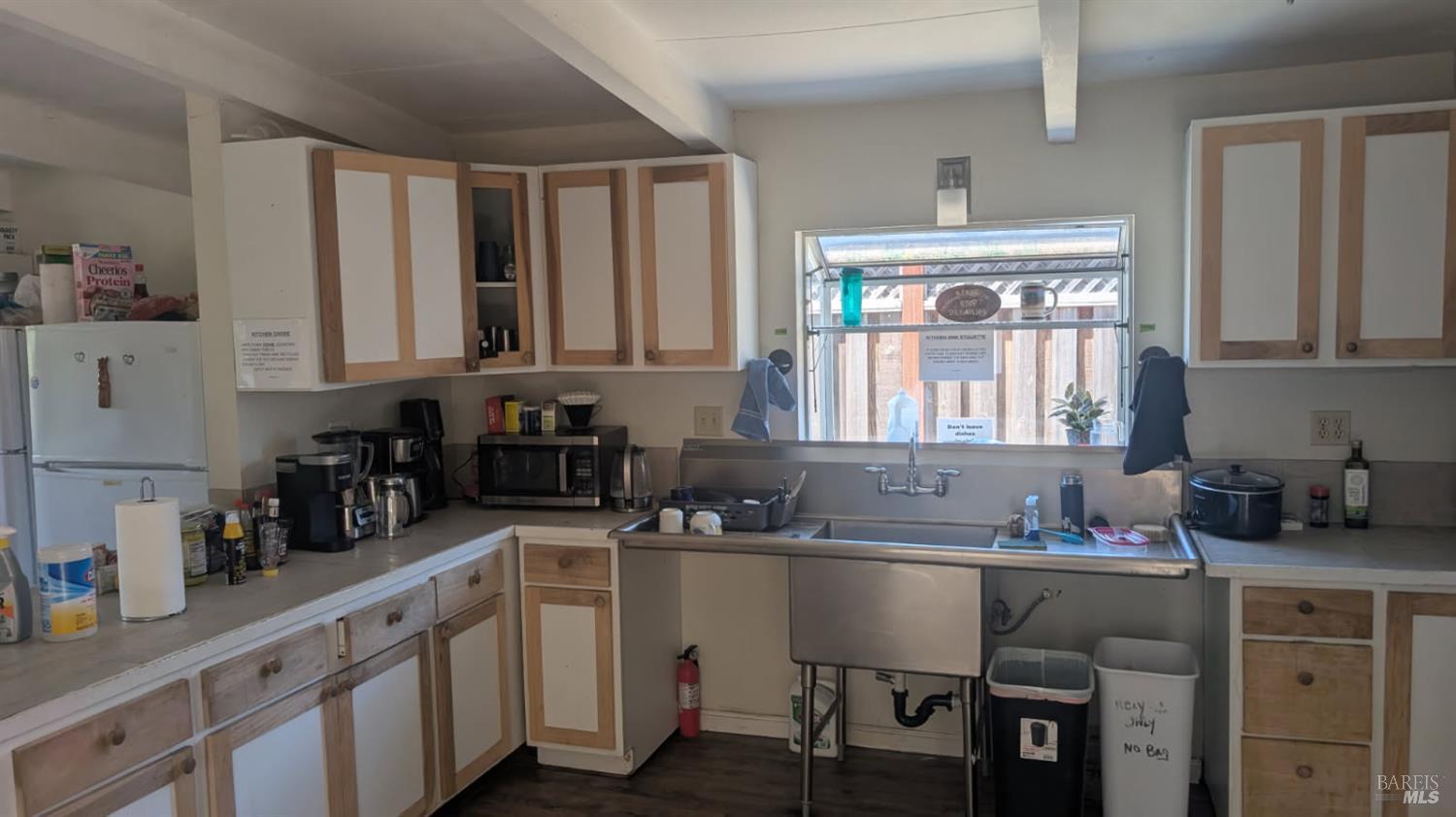 359 Bonnie Avenue Rohnert Park, CA 94928 - Photo 5 of 13 a kitchen with a sink cabinets and window
