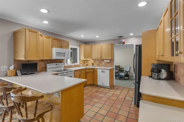 a kitchen with a sink appliances and cabinets