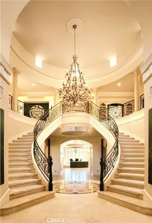 a view of a chandelier in a hallway