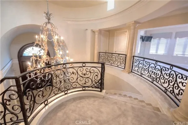a living room with fireplace furniture and a large window