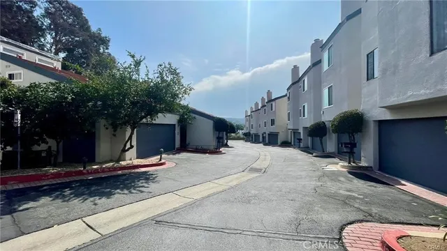 a view of a street with some trees