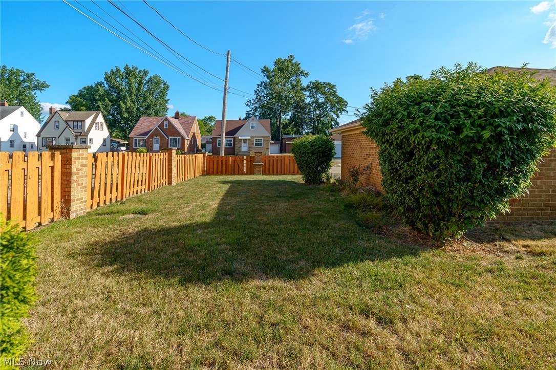 6572 South Canterbury Road Cleveland, OH 44129 - Photo 33 of 36 Nice brick and wood fence along the side and back yard