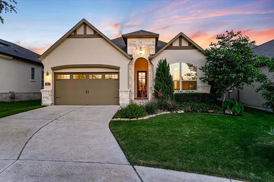 1017 Turning Leaf Trail Georgetown, TX 78628 - Photo 1 of 1 a front view of a house with a yard and garage
