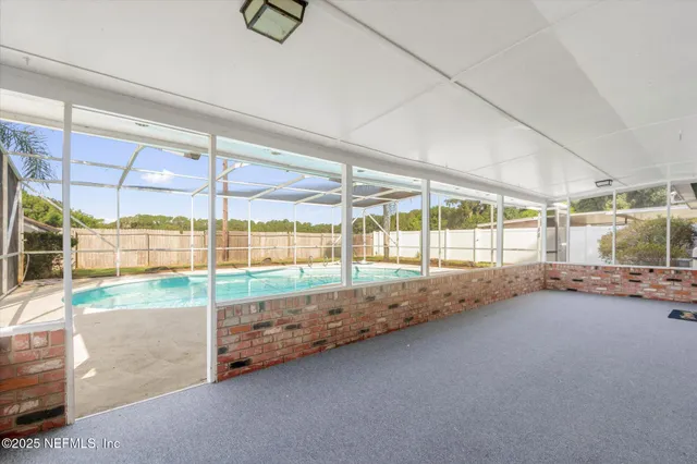 a view of an empty room and window
