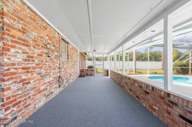 a view of an empty room with a balcony