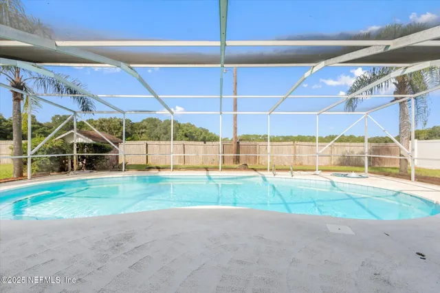 a view of backyard with green space