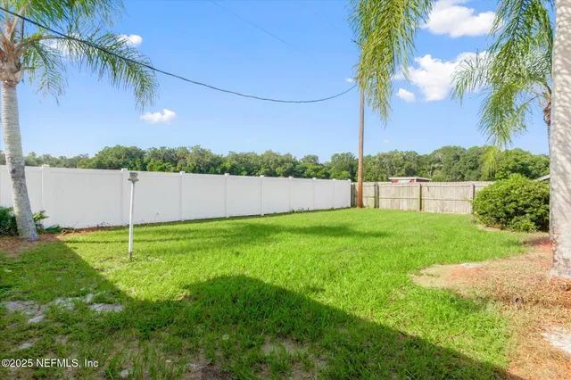 a front view of house with yard and outdoor seating