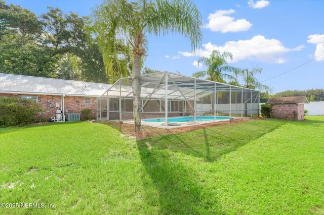 a view of a swimming pool with a patio