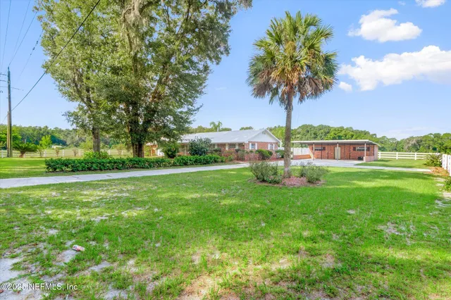 a view of a house with a big yard