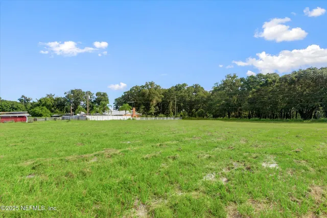 a view of a lake with a yard