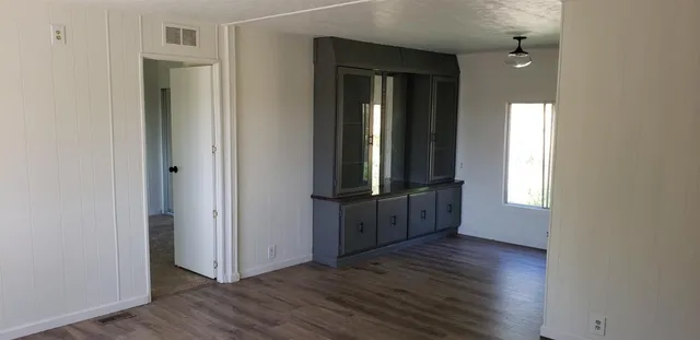 a kitchen with a refrigerator and a sink