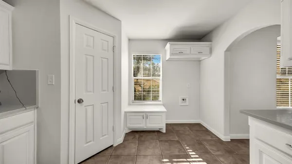 a view of a livingroom with a kitchen