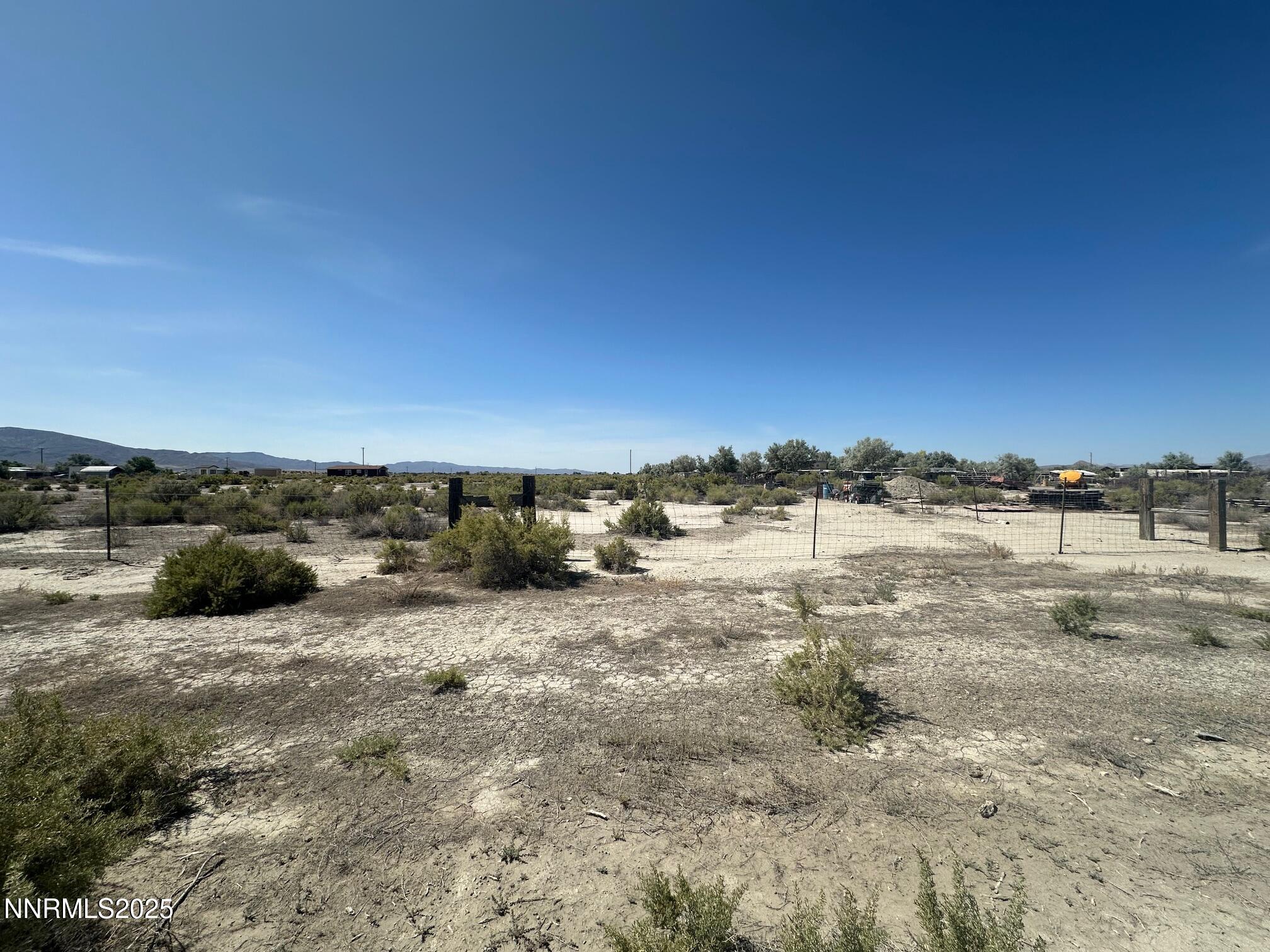 1100 Horseshoe Bend Road Lovelock, NV 89419 - Photo 7 of 10 a view of a dry yard with wooden fence