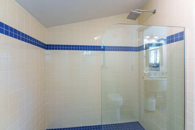 a view of a room with wooden floor and windows